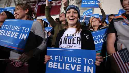 young-women-with-bernie-sanders-signs