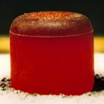 This is an image of a glowing red hot pellet of plutonium-238 dioxide to be used in a radioisotope thermoelectric generator