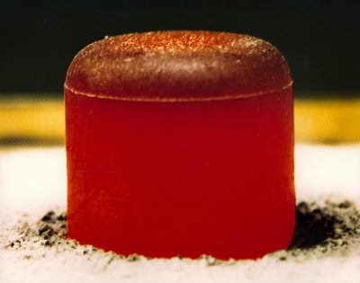 This is an image of a glowing red hot pellet of plutonium-238 dioxide to be used in a radioisotope thermoelectric generator