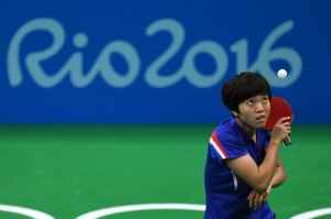North Korea's Kim Song I serves against China's Ding Ning in their women's singles semi-final table tennis match at the Riocentro venue during the Rio 2016 Olympic Games in Rio de Janeiro on August 10, 2016. / AFP / Jim WATSON (Photo credit should read JIM WATSON/AFP/Getty Images)