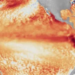 Imagem satelital mostra o fenômeno do El Niño com áreas de água quente no Pacífico. (Foto: sciencenews.org)