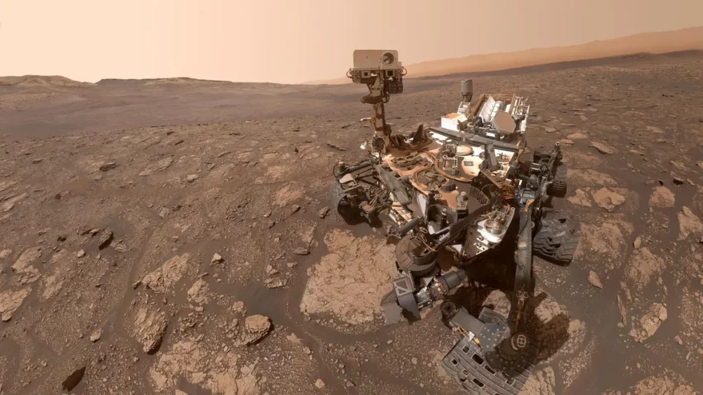 O rover Curiosity da NASA em Marte, explorando a superfície marciana. (Foto: sciencedaily.com)